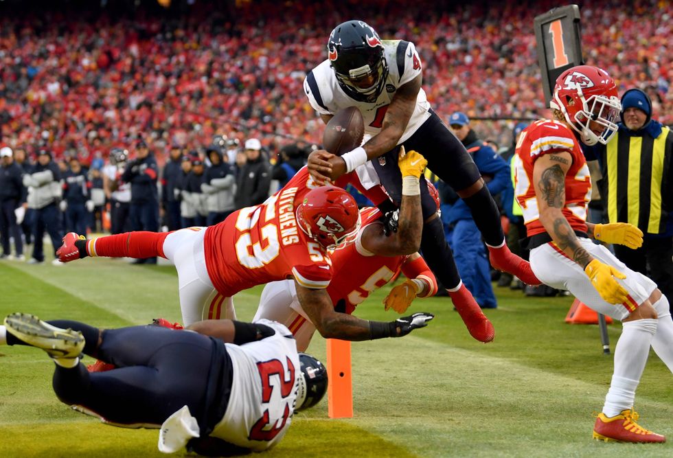 Deshaun Watson goes airborne for a touchdown against Kansas City