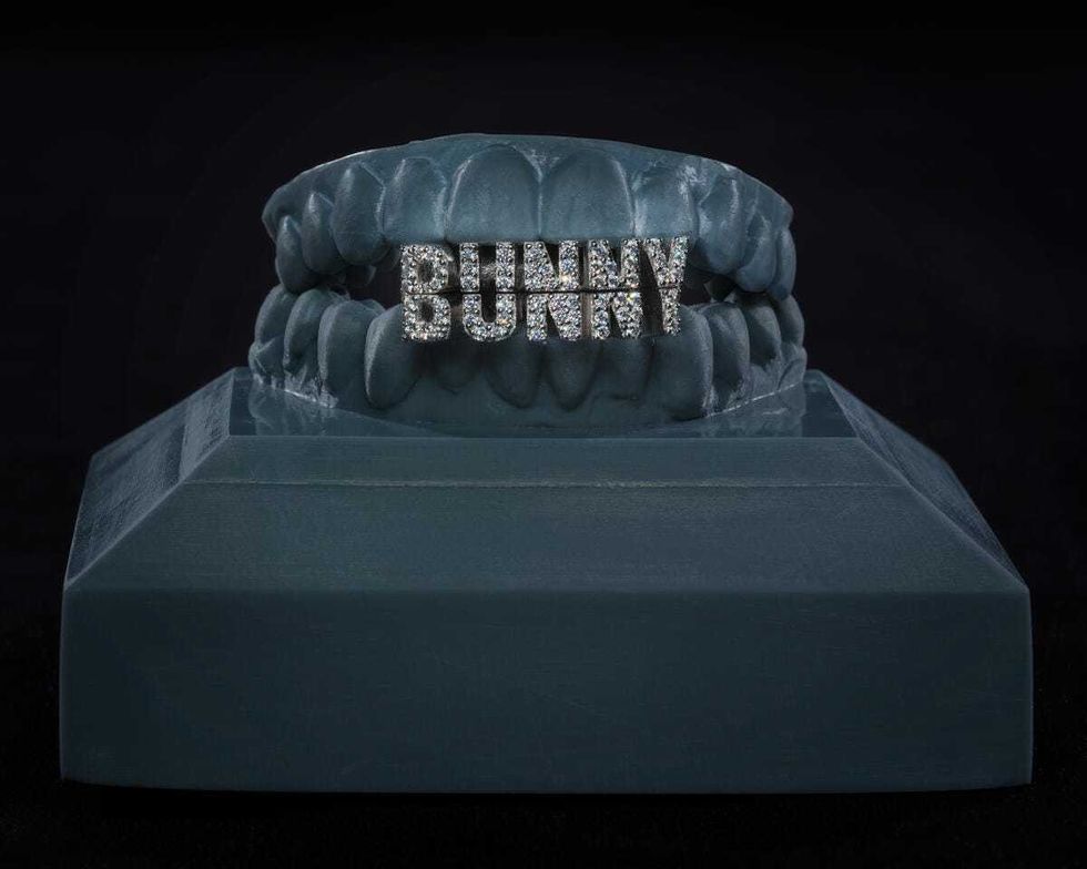 Designed for Bad Bunny by ALLIGATOR JESUS (David Tamargo) in 2023, this grill set features 14-karat white gold with sparkling diamonds and rhodium plating.