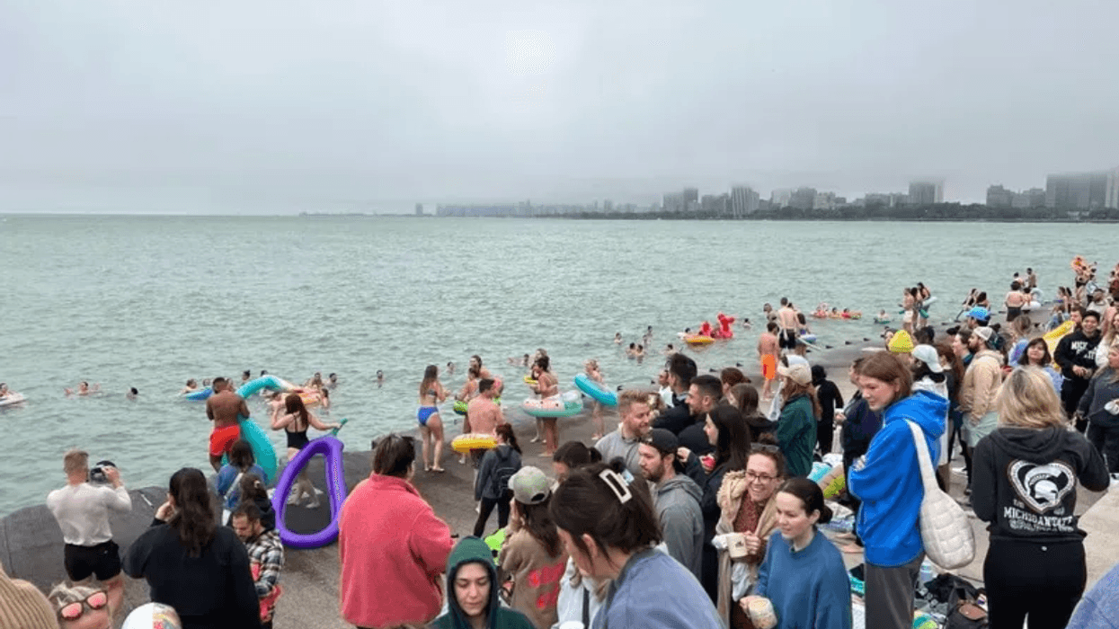 Despite cloudy weather, hundreds of people turn out for a Friday Morning Swim Club in 2023. Organizers of the weekly event said it would not return in 2024.