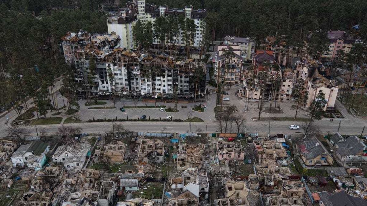 Destroyed houses are seen next to heavily damaged apartment buildings on April 18, 2022 in Irpin, Ukraine.