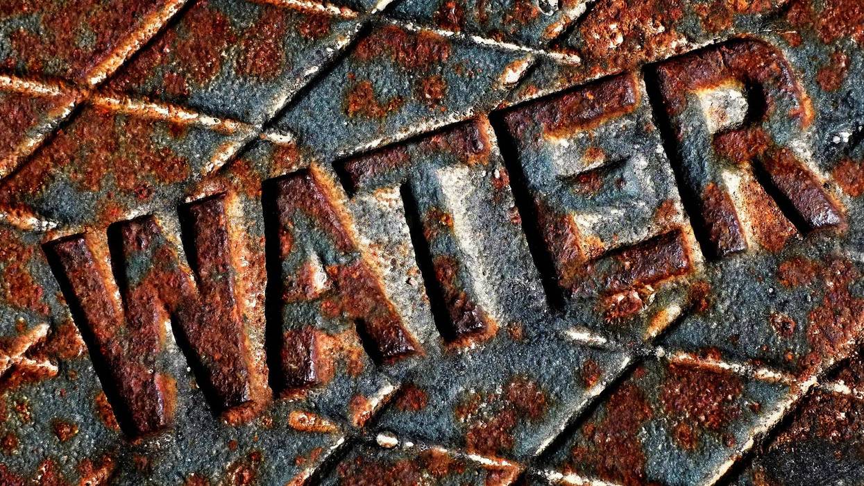 Detail of iron water cover man hole rusty lid