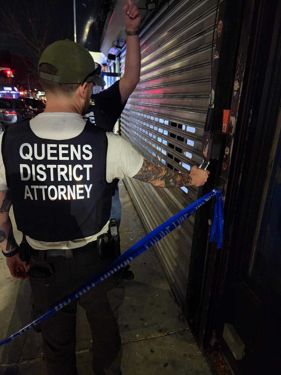 Detectives with the Queens District Attorney
