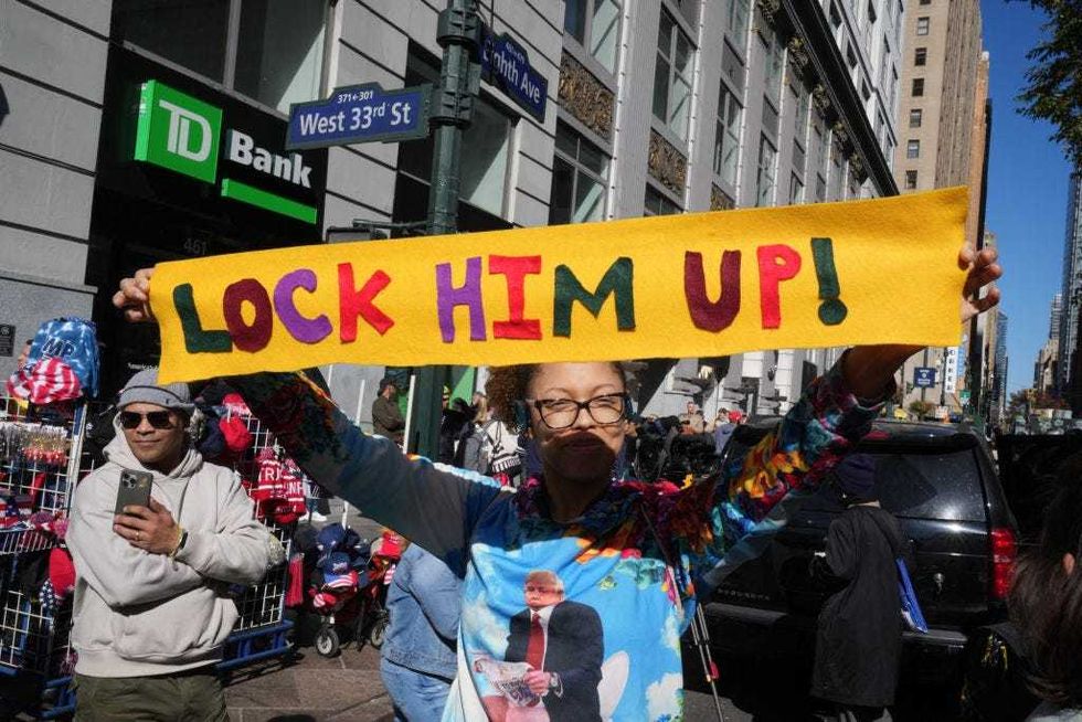 Detractors of former U.S. President and Republican presidential candidate Donald Trump protest as his supporters arrive for a campaign rally at Madison Square Garden in New York, Oct. 27, 2024.