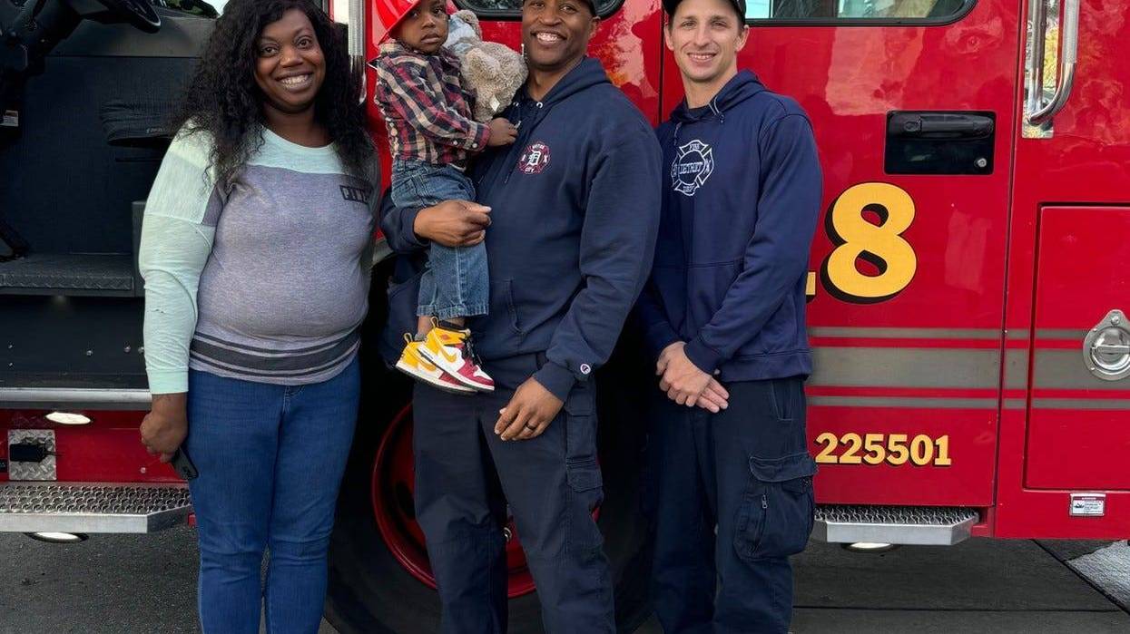 Detroit firefighters with Jasmine and Jayvion