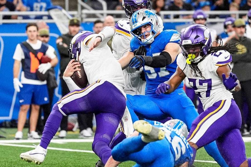 Detroit Lions defensive end Aidan Hutchinson (97) sacks Minnesota Vikings quarterback J.J. McCarthy (9) during the second half at Ford Field in Detroit on Sunday, November 2, 2025.