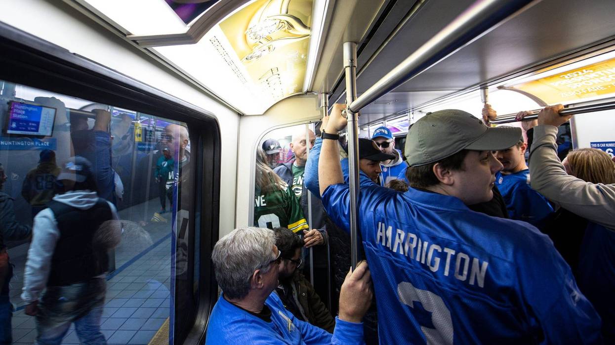 Detroit Lions fans on Detroit People Mover during NFL Draft