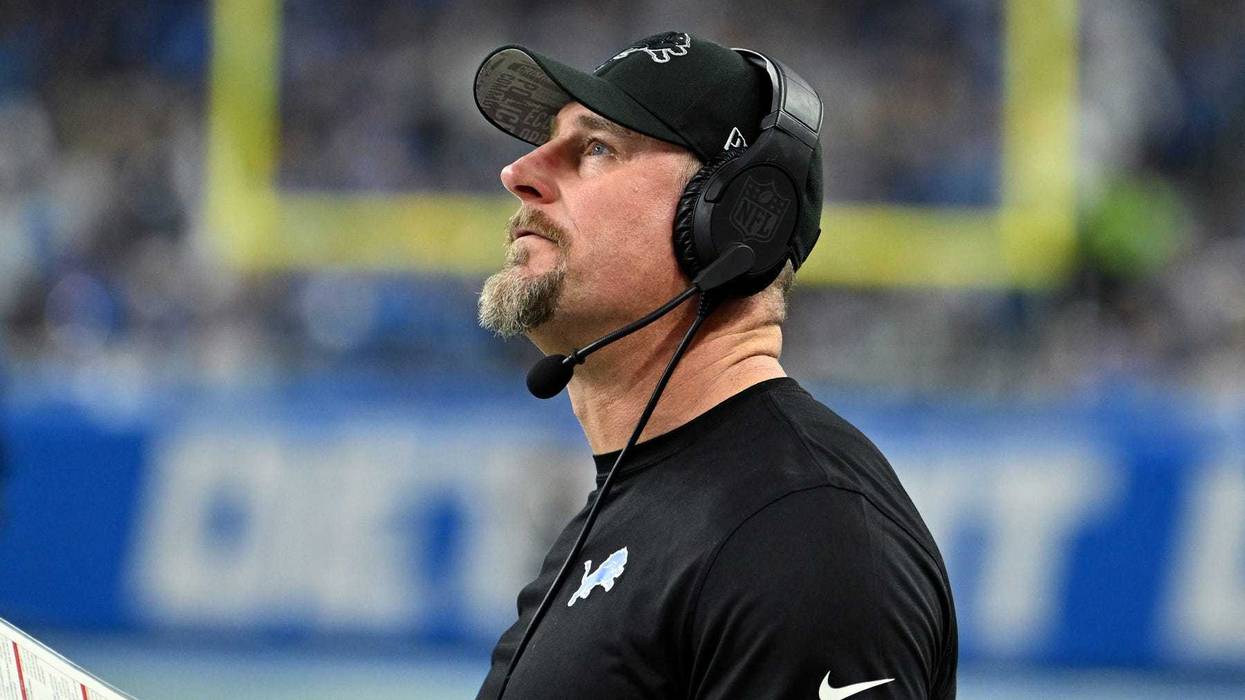 Detroit Lions head coach Dan Campbell looks on against the Tampa Bay Buccaneers during the first half in a 2024 NFC divisional round game at Ford Field.