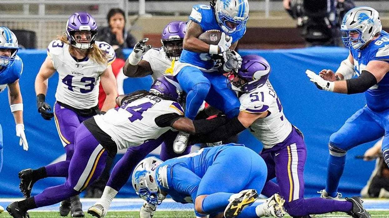Detroit Lions running back Jahmyr Gibbs (0) was almost totally bottled up by the Minnesota Vikings at Ford Field in Detroit on Sunday, November 2, 2025.