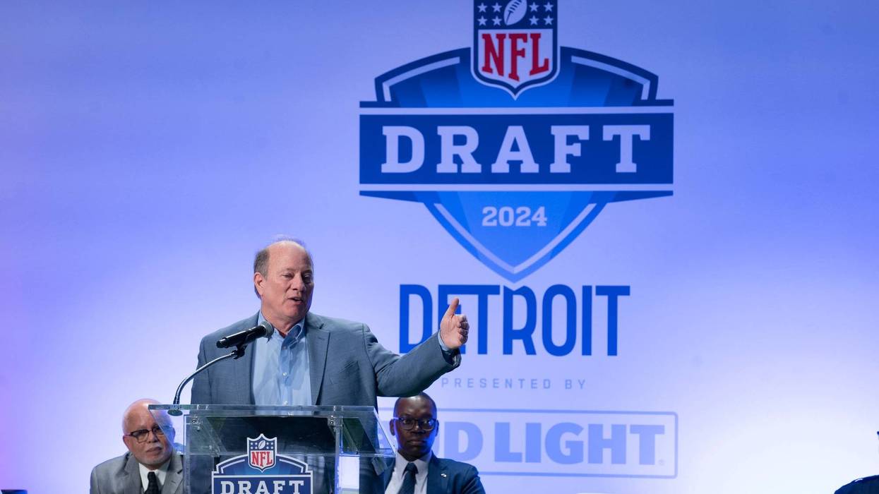 Detroit Mayor Mike Duggan in front of NFL Draft sign