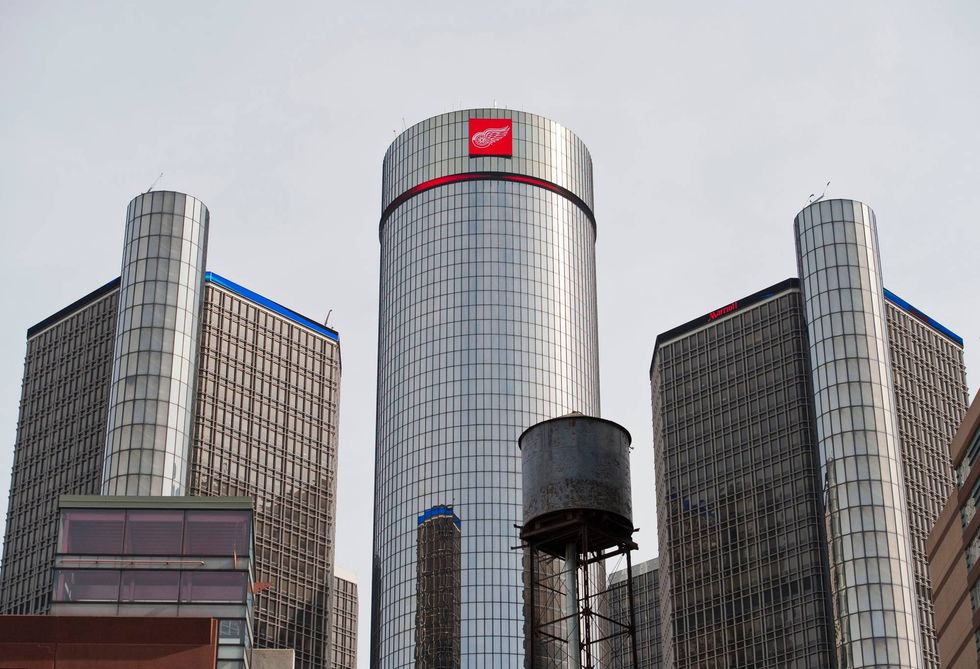 DETROIT, MI - APRIL 13: The Detroit Red Wings hockey team logo is displayed atop its Renaissance Center World Headquarters prior to Game 1 of the Red Wings playoff series against the Phoenix Coyotes April 13, 2011 in Detroit, Michigan. The new LED sign on top of the GM World Headquarters will feature the Red Wings logo for 30 seconds every two minutes on the day of every home playoff game throughout the Stanley Cup Playoffs.