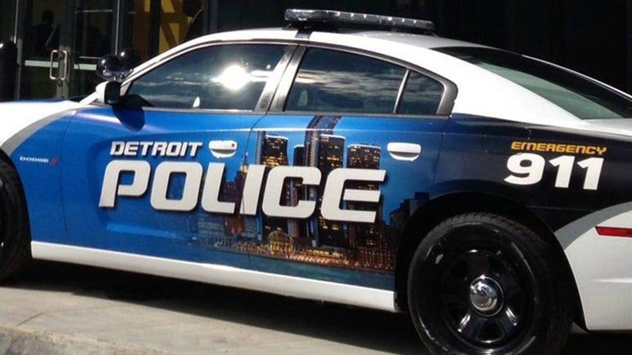 Detroit Police car with a wrap featuring the city skyline