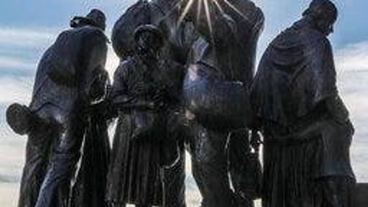 Detroit's Underground Railroad monument with the sun shining through from behind.