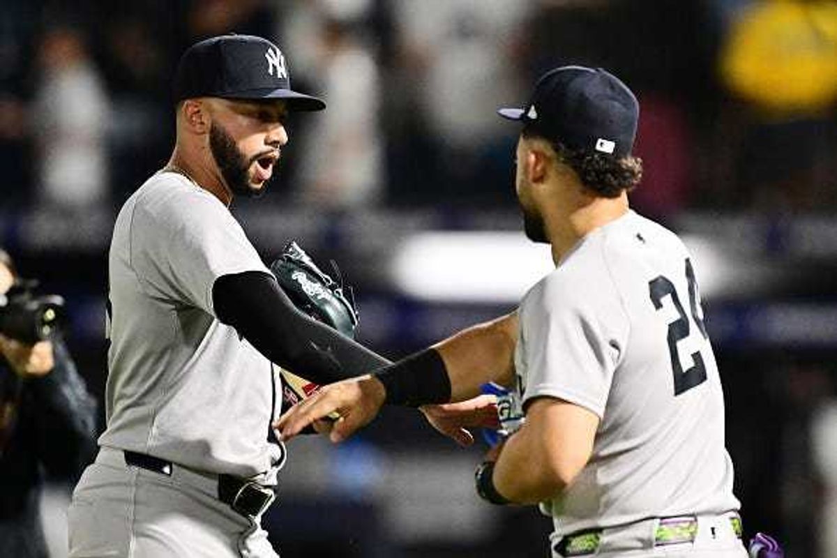 Devin Williams #38 celebrates with Jasson Domínguez #24 of the New York Yankees after defeating the Tampa Bay Rays 6-3 at George M. Steinbrenner Field on April 17, 2025 in Tampa, Florida. (Photo by Julio Aguilar/Getty Images)