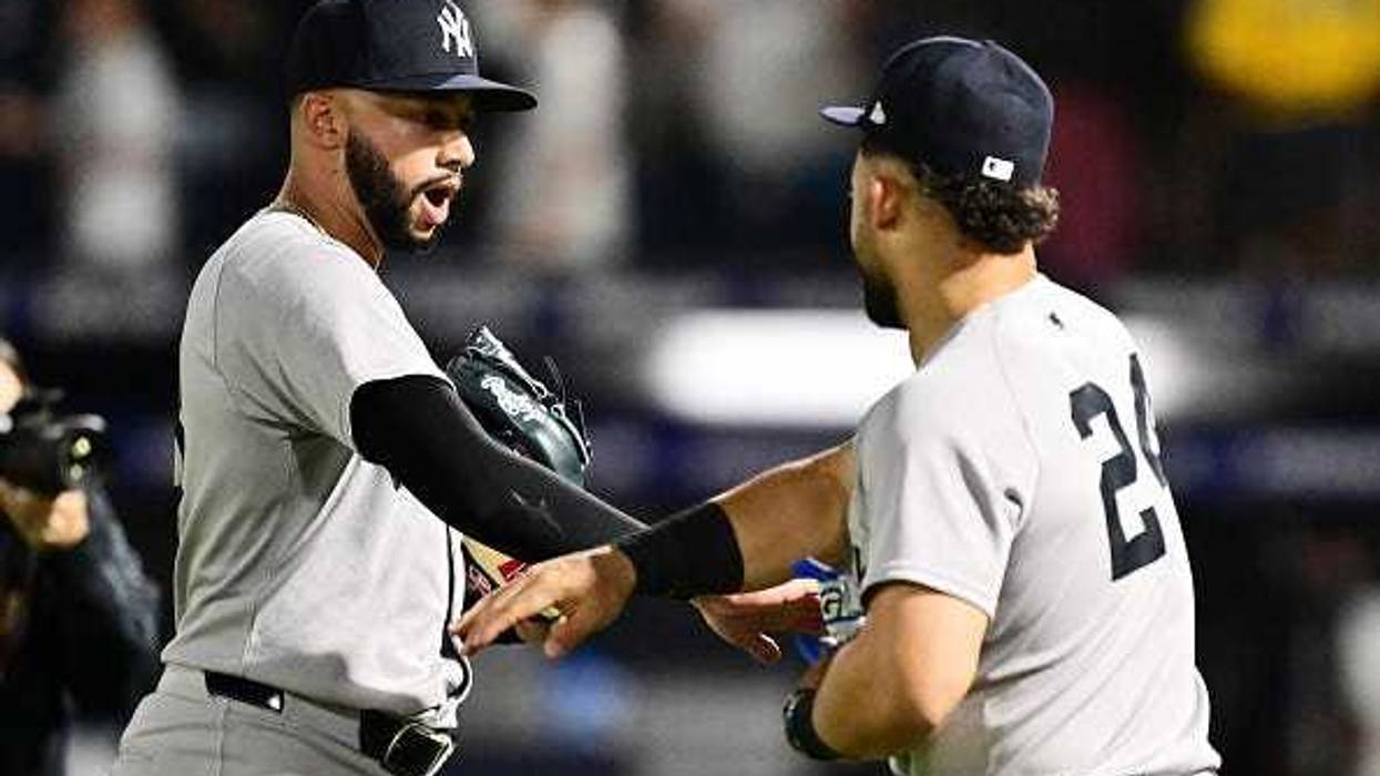 Devin Williams #38 celebrates with Jasson Domínguez #24 of the New York Yankees after defeating the Tampa Bay Rays 6-3 at George M. Steinbrenner Field on April 17, 2025 in Tampa, Florida. (Photo by Julio Aguilar/Getty Images)