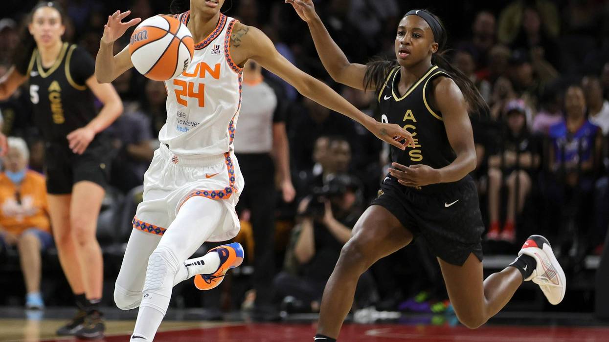 DeWanna Bonner #24 of the Connecticut Sun chases down a loose ball under pressure from Jackie Young #0 of the Las Vegas Aces during their game at Michelob ULTRA Arena on June 02, 2022 in Las Vegas, Nevada. The Sun defeated the Aces 97-90.