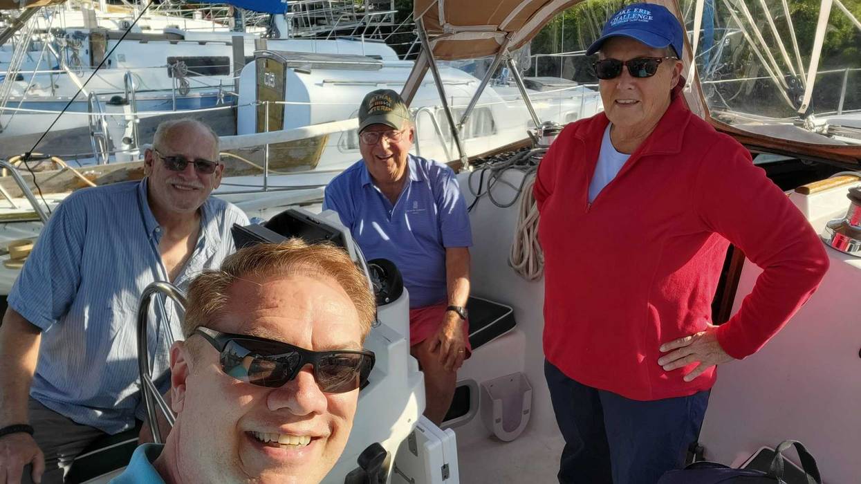 Diana Augspurger (in red) and local veterans after a recent sail