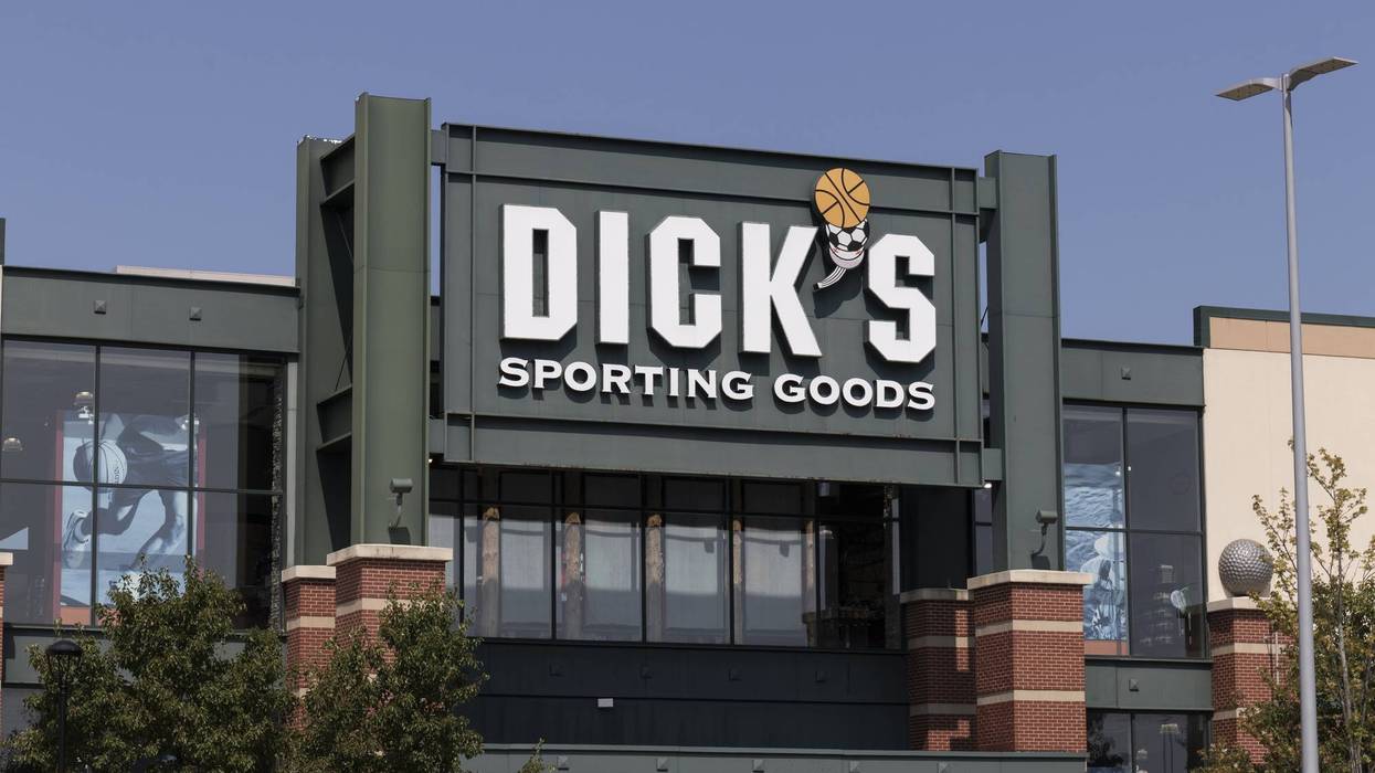 Dick's Sporting Goods store exterior with prominent sign featuring a basketball and soccer ball logo.