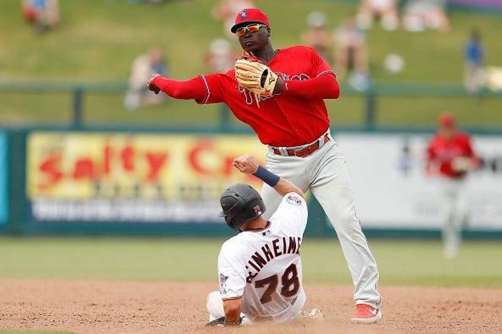 Didi Gregorius turns a double play in spring training.