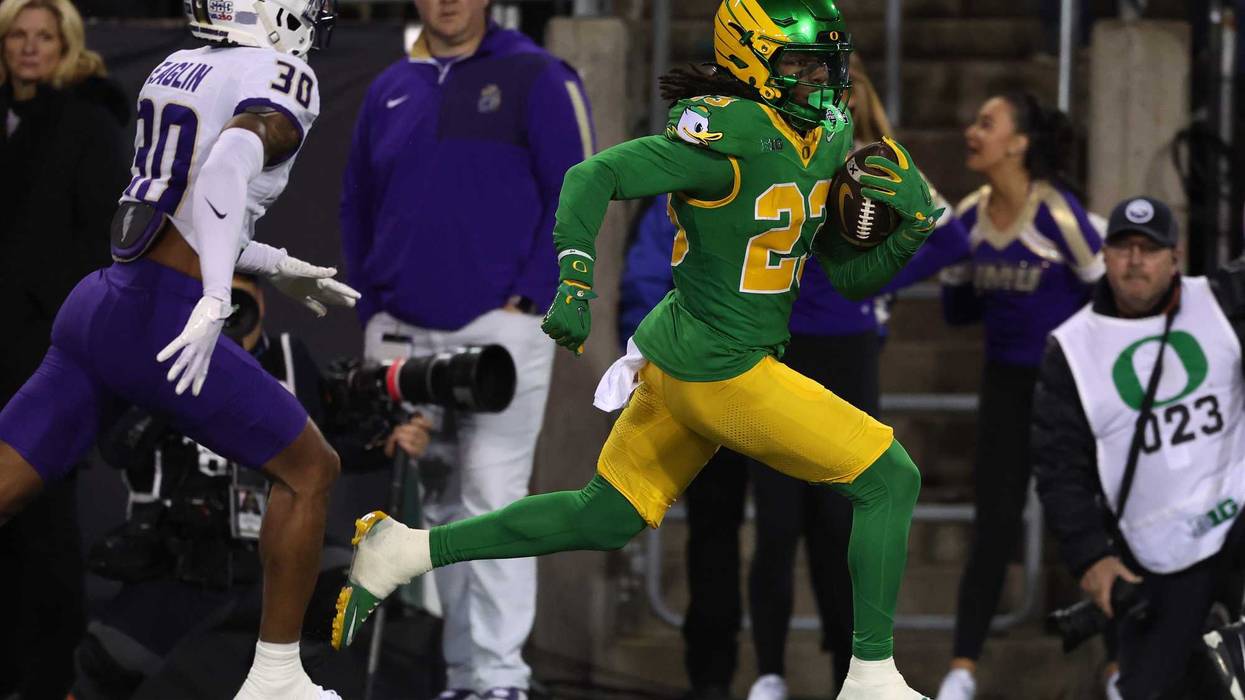 Dierre Hill Jr. #23 of the Oregon Ducks runs for a touchdown during the second quarter against the James Madison Dukes during the 2025 College Football Playoff First Round Game at Autzen Stadium on December 20, 2025 in Eugene, Oregon.