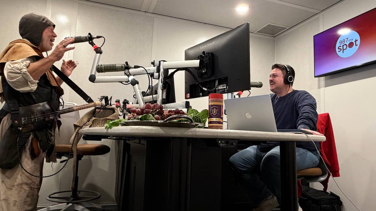 Luckey chats with Digger Plotz, a Grave Singer with the Scarborough Renaissance Festival