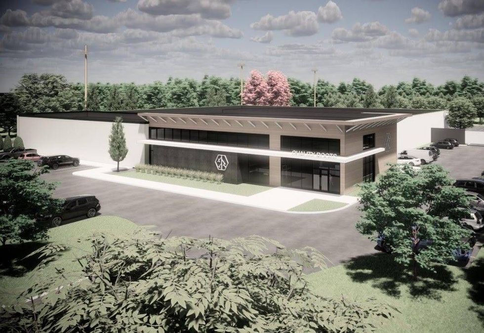 Digital rendering of upcoming cannabis facility. Large modern warehouse with a granite and glass front. A double awning wraps around the front office and a small row of plants lines the front lawn.