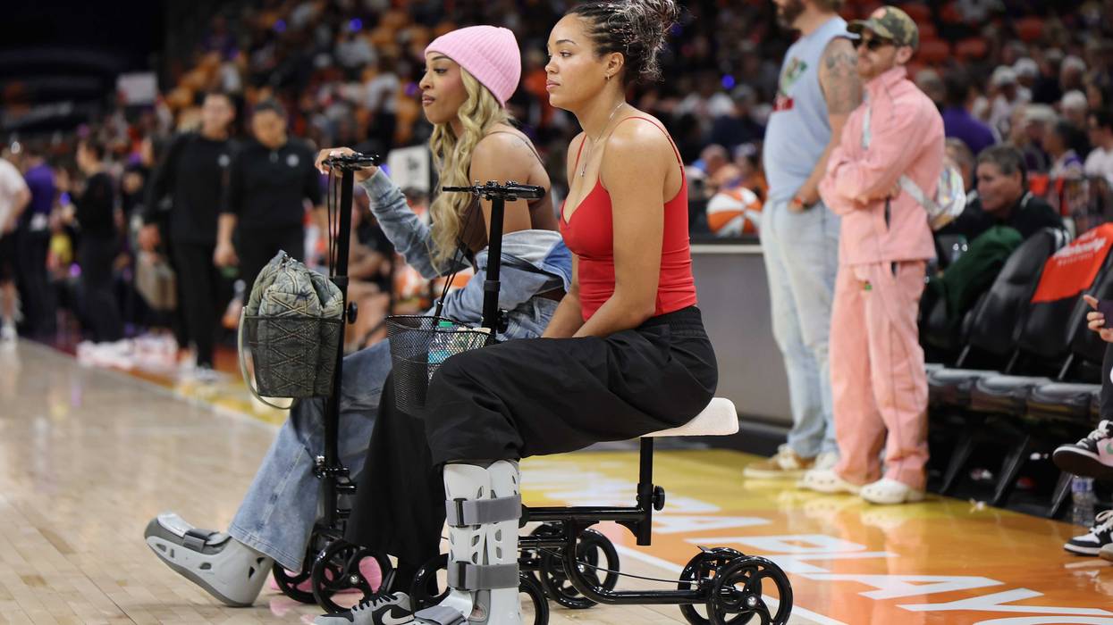 DiJonai Carrington #3 and Napheesa Collier #24 of the Minnesota Lynx watch warmups before Game Four of the 2025 WNBA Playoffs semifinals against the Phoenix Mercury at PHX Arena on September 28, 2025 in Phoenix, Arizona.
