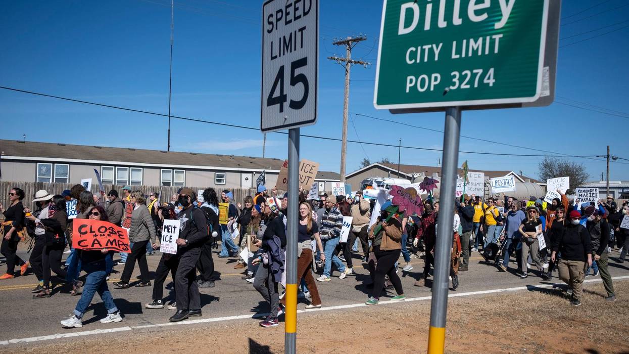 DILLEY, TEXAS - JANUARY 28: People protest against Immigration and Customs Enforcement as they march toward the South Texas Family Residential Center on January 28, 2026 in Dilley, Texas. A federal judge temporarily blocked the deportation of 5-year-old Liam Conejo Ramos and his father, Adrian Conejo Arias, who were arrested in Minneapolis after the father had picked the boy up from school. They were then taken to the South Texas Family Residential Center, an immigration detention center outside San Antonio, where they remain. (Photo by Joel Angel Juarez/Getty Images)