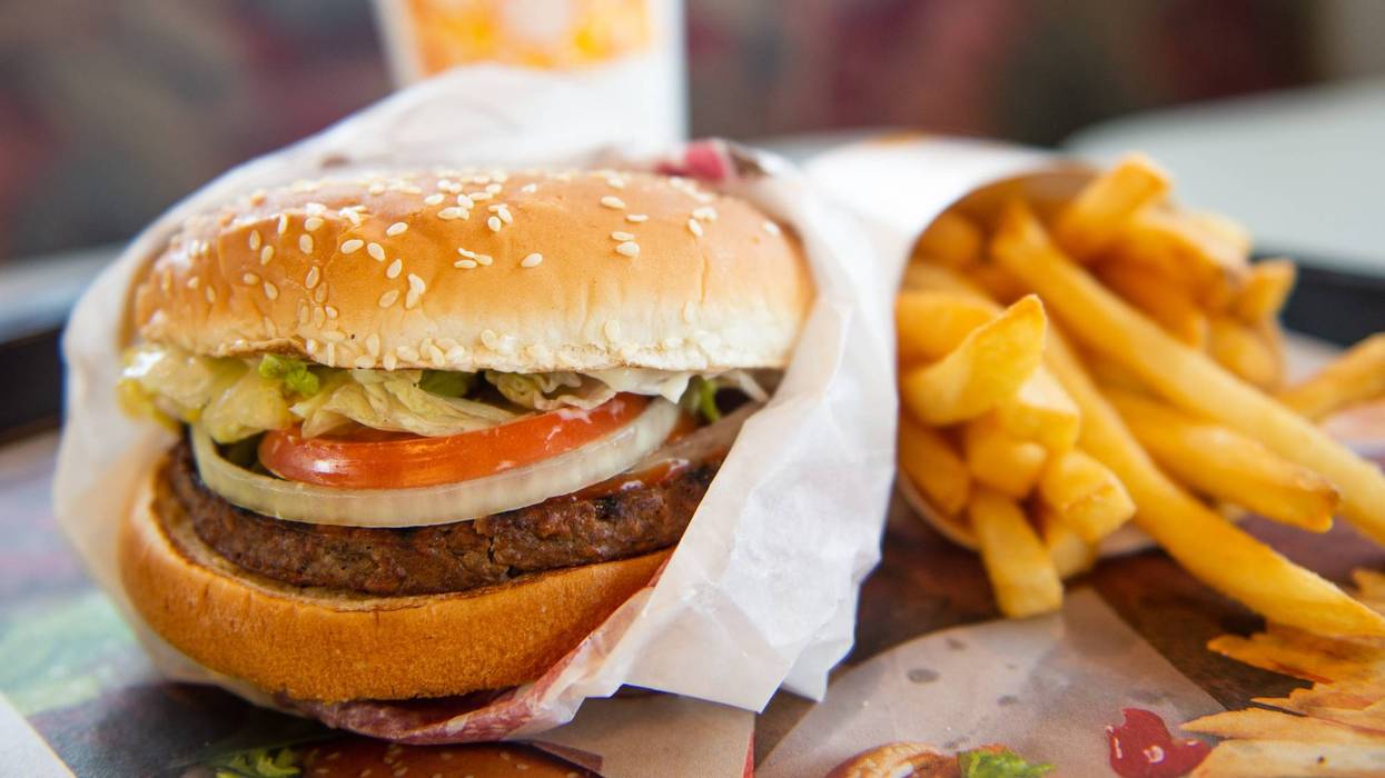 Diner enjoys a Burger King Impossible Whopper