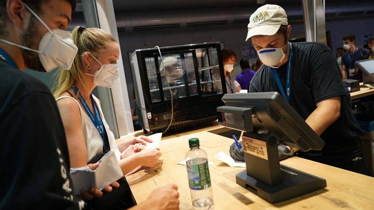 Diners wearing face coverings order at a Las Vegas restaurant