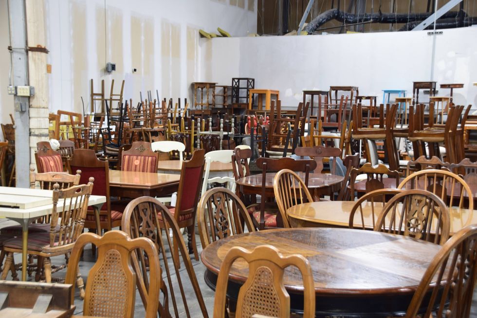 Dining room tables and chair stored in Home Sweet Home's warehouse
