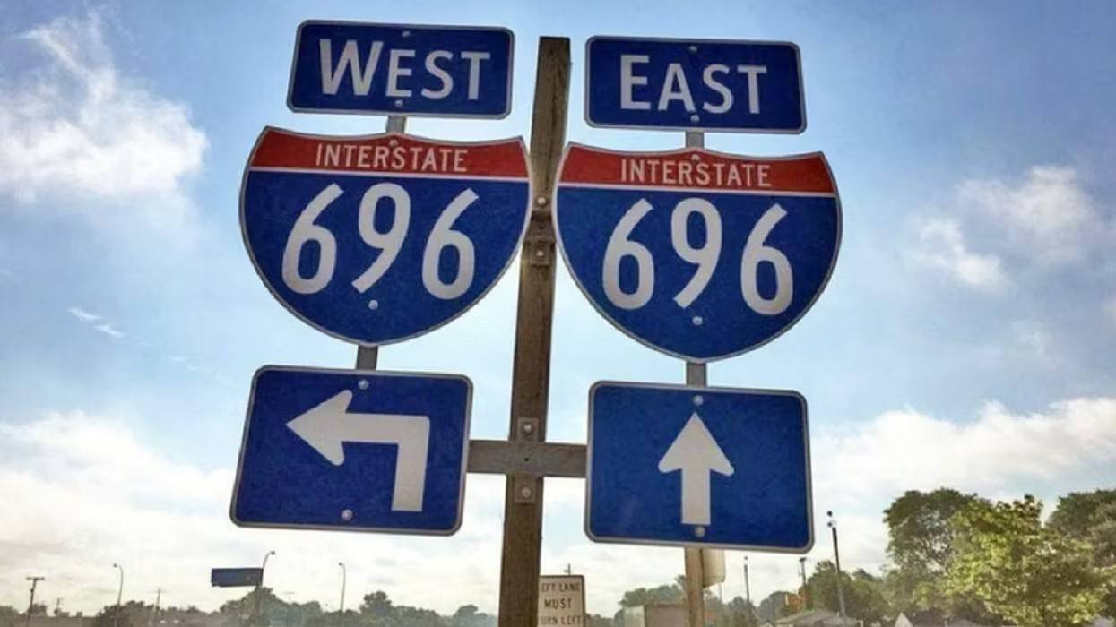 Directional highway signs for I-696 West (left) and I-696 East (straight).