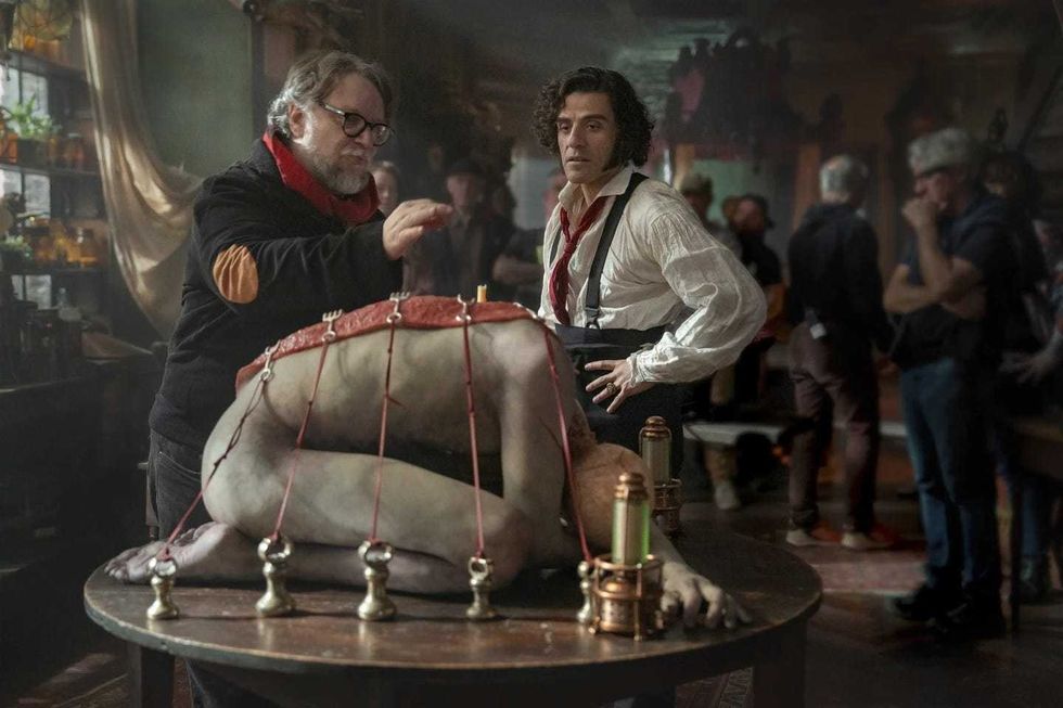 Director Guillermo del Toro and Oscar Isaac on the set of “Frankenstein,” releasing Oct. 17
