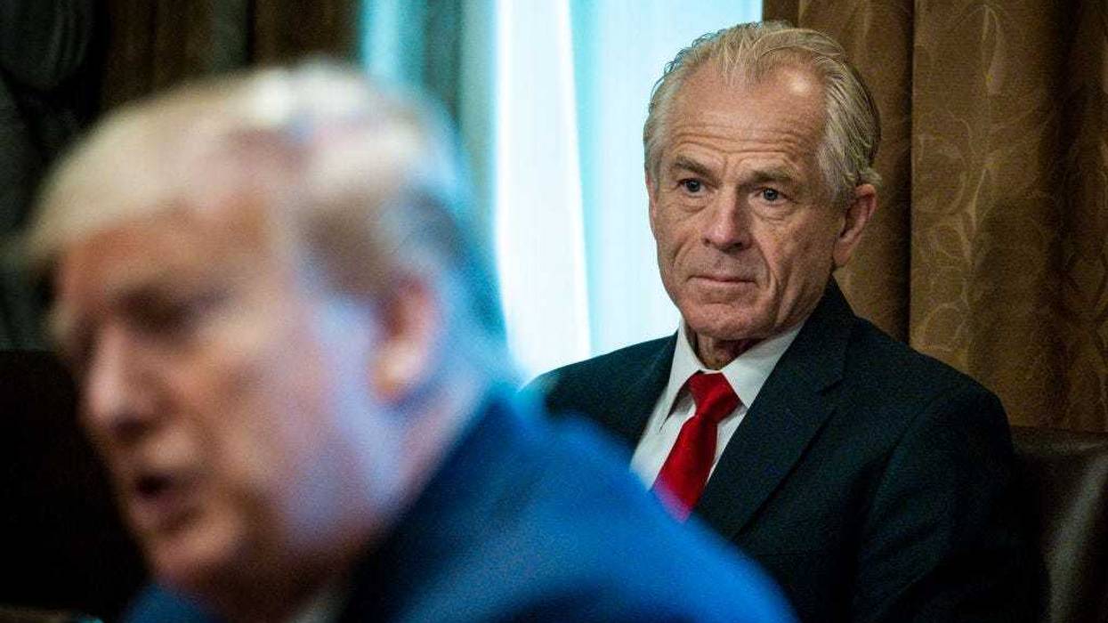 Director of the National Trade Council Peter Navarro looks on as President Donald Trump meets with supply chain distributors in reference to the COVID-19 coronavirus pandemic, in the Cabinet Room in the West Wing at the White House on Sunday, March 29, 2020. (Photo by Pete Marovich-Pool/Getty Images)