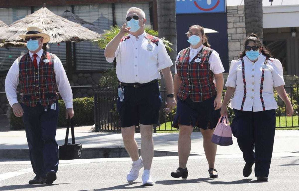 Disney employees wearing masks.
