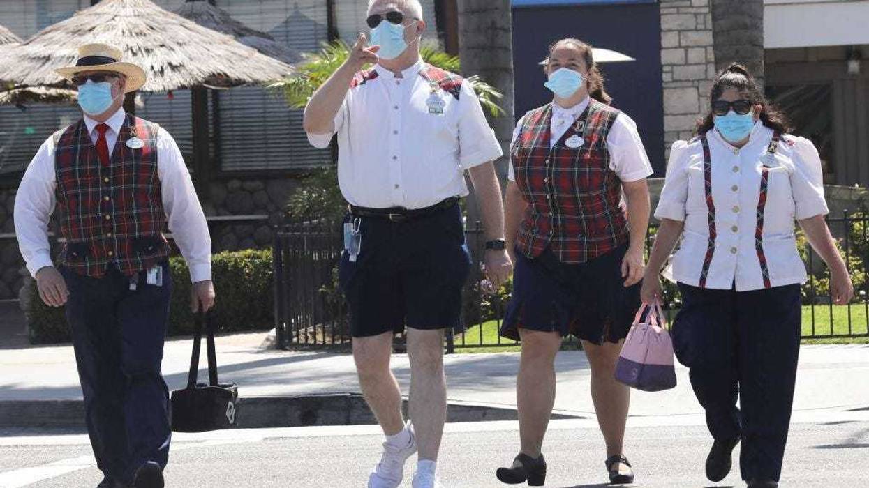 Disney employees wearing masks.