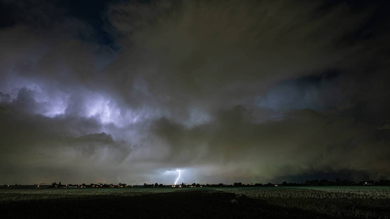 Distant lightning from a nighttime thunderstorm