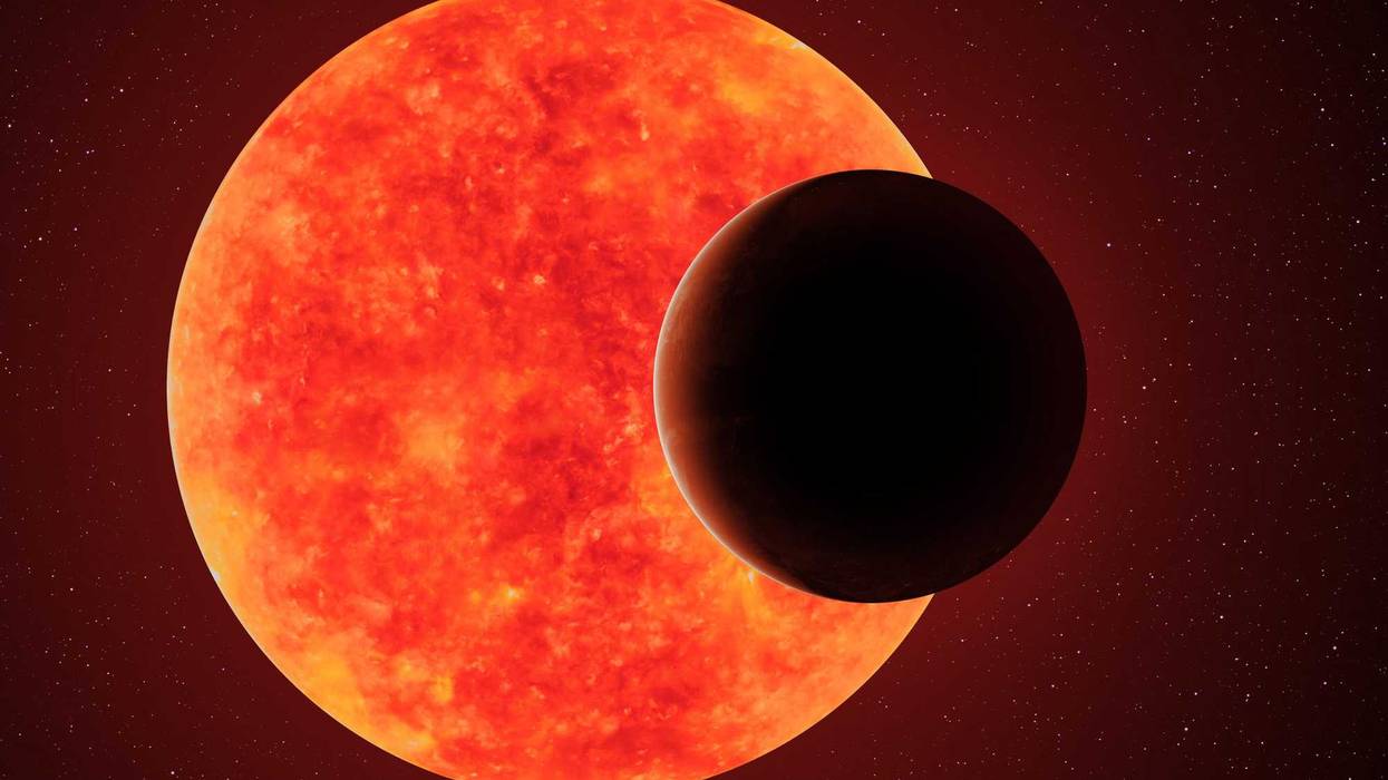 Distant planet in front of a star.