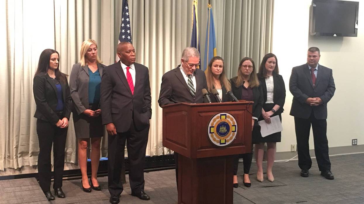 District Attorney Larry Krasner is shown with special victims detectives and assistant district attorneys.