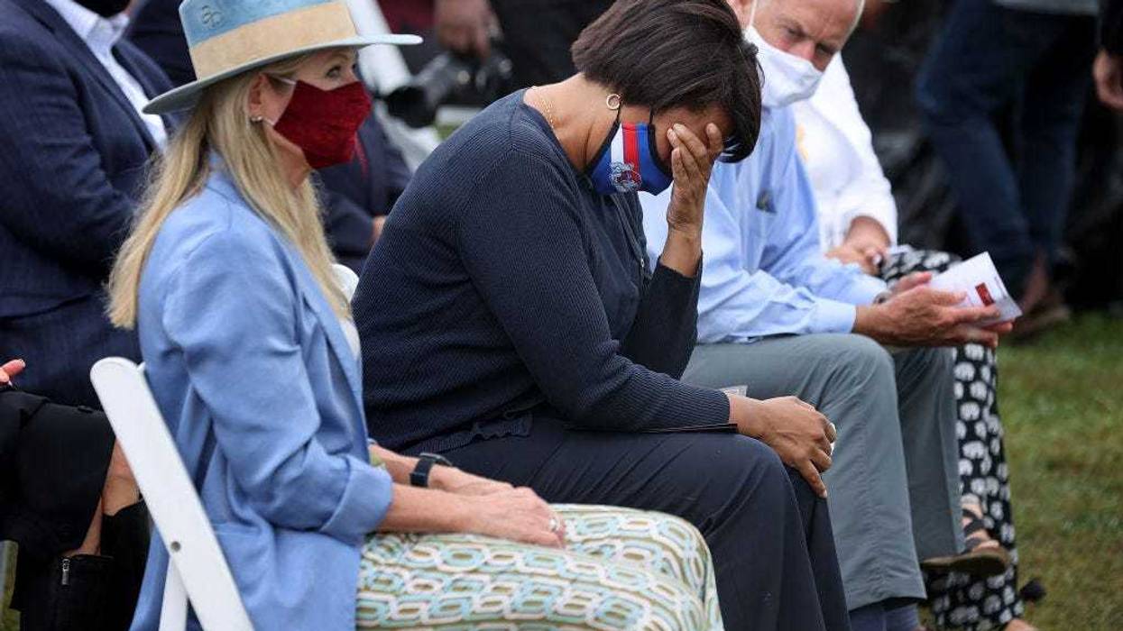 District of Columbia Mayor Muriel Bowser is overcome with emotion during the opening ceremony of 'In America: Remember,' a public art installation commemorating all the Americans who have died due to COVID-19 near the Washington Monument on September 17, 2021 in Washington, DC.