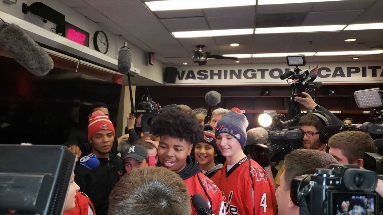 Divyne Apollon II of the Metro Maple Leafs meets his hockey heroes, the Washington Capitals