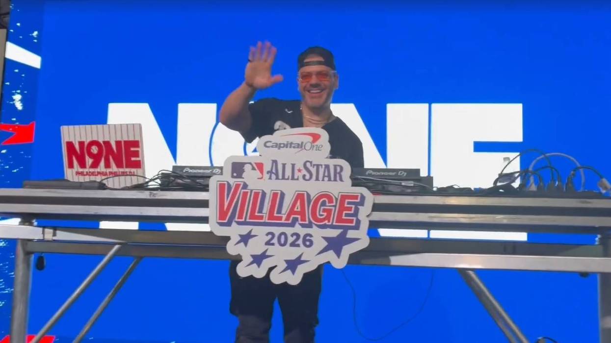 DJ waves for camera at MLB All-Star Village