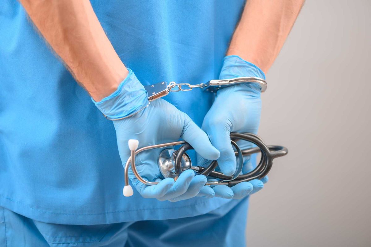 Doctor arrest stock photo.