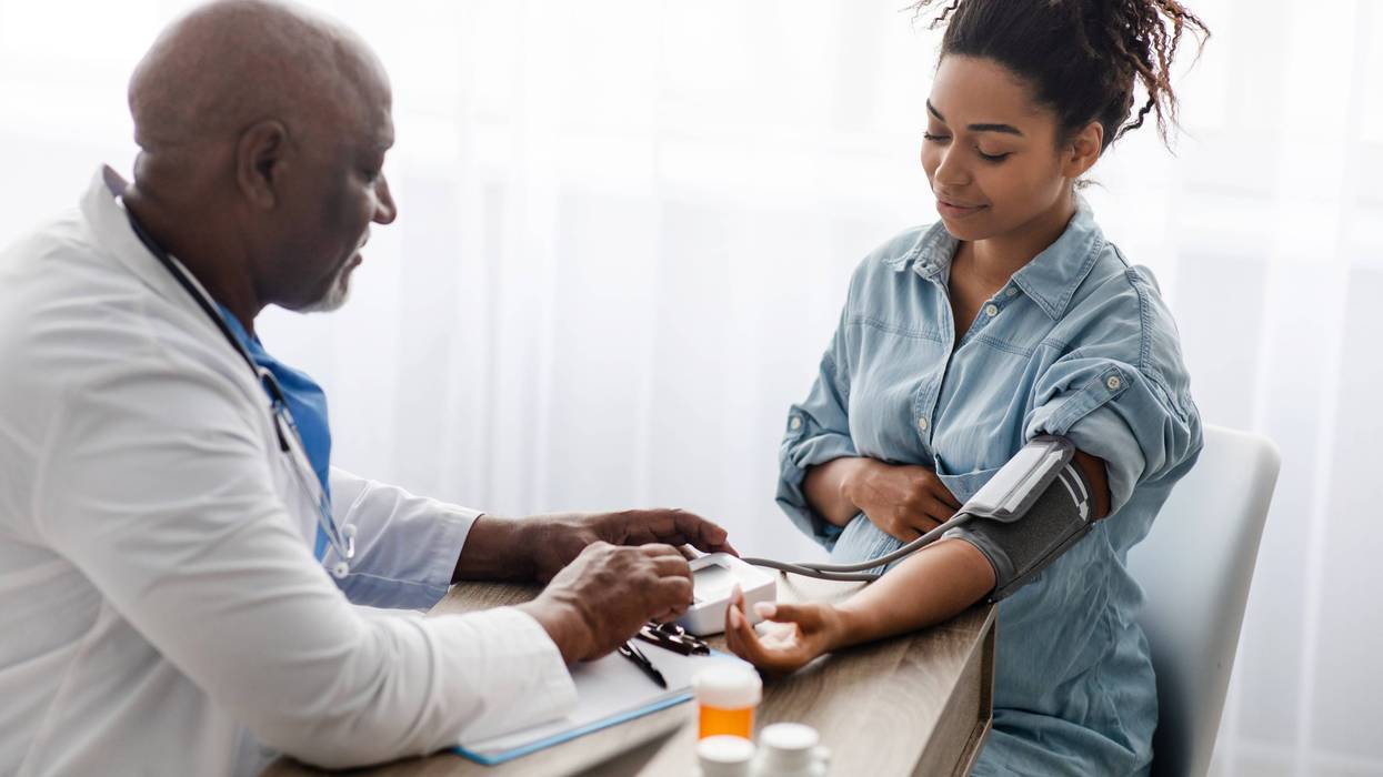 Doctor checking a patient's blood pressure