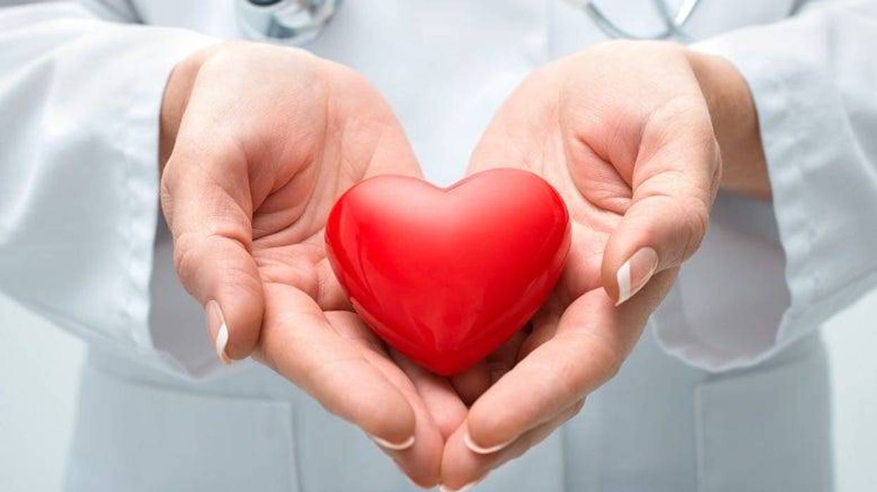 doctor holding a tiny heart