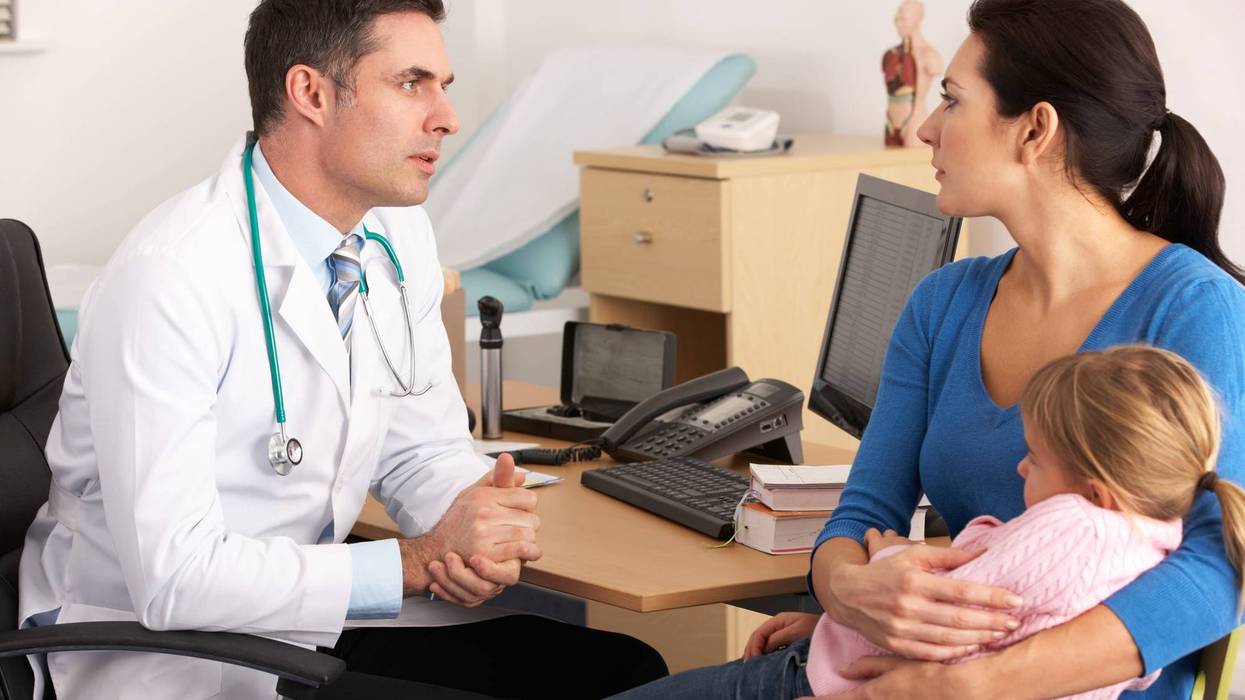 doctor talking to mother