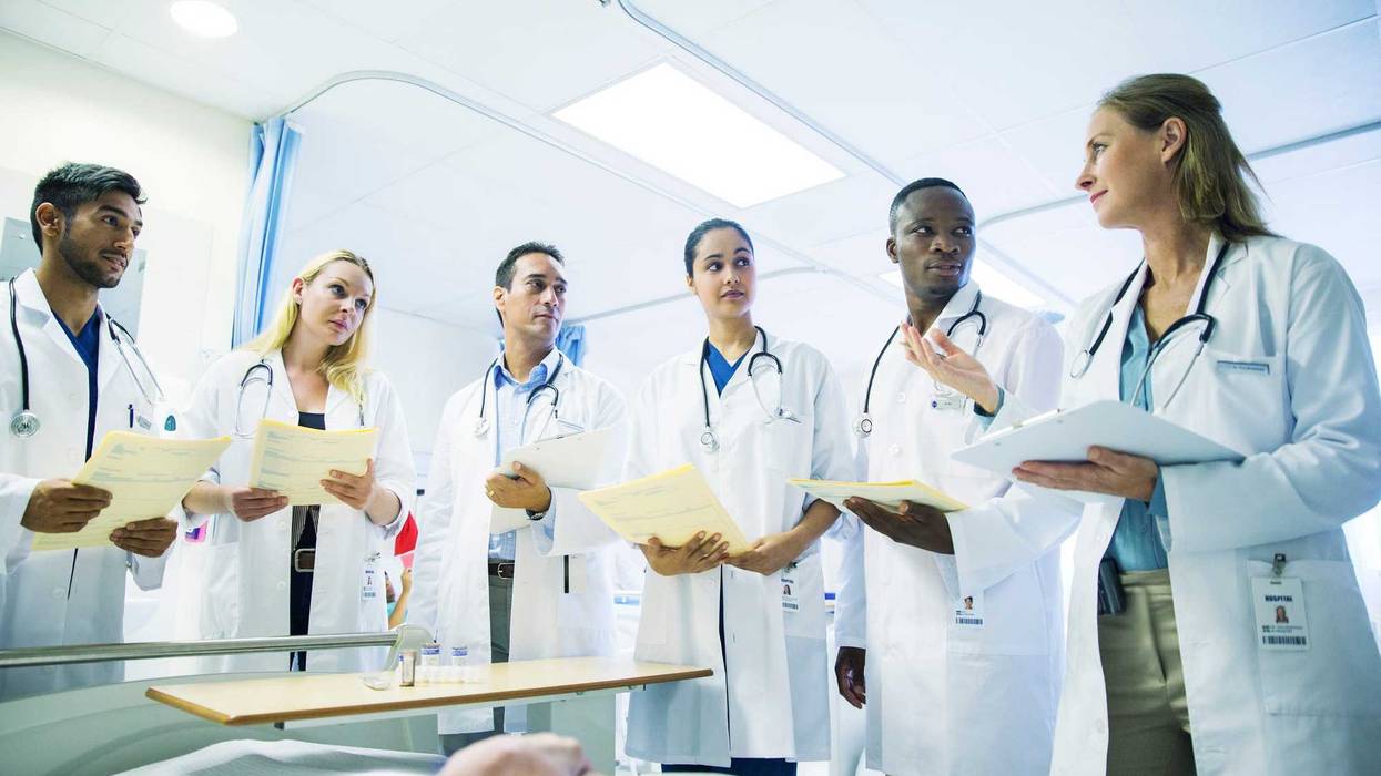 Doctor teaching medical students.