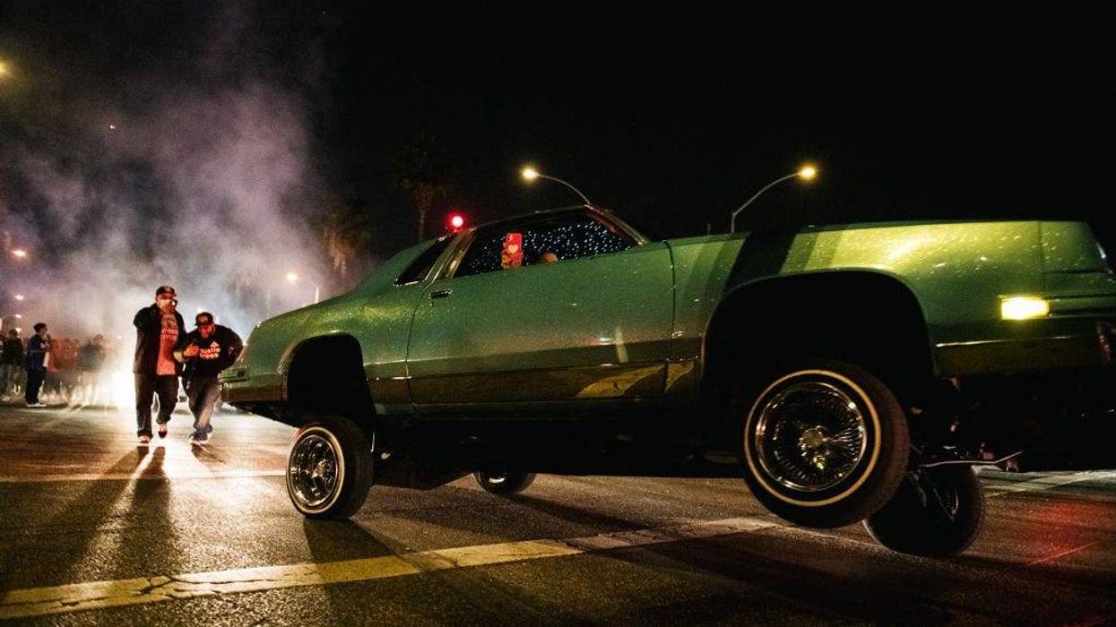 Dodgers fans celebrate in a lowrider vehicle after the Los Angeles Dodgers defeated the Tampa Bay Rays 3-1 on October 27, 2020 in Los Angeles, California.