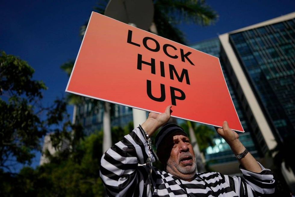 Domenic Santana stands outside the Wilkie D. Ferguson Jr. U.S. Courthouse, Tuesday, June 13, 2023, in Miami. Former President Donald Trump is making a federal court appearance today on dozens of felony charges accusing him of illegally hoarding classified documents and thwarting the Justice Department