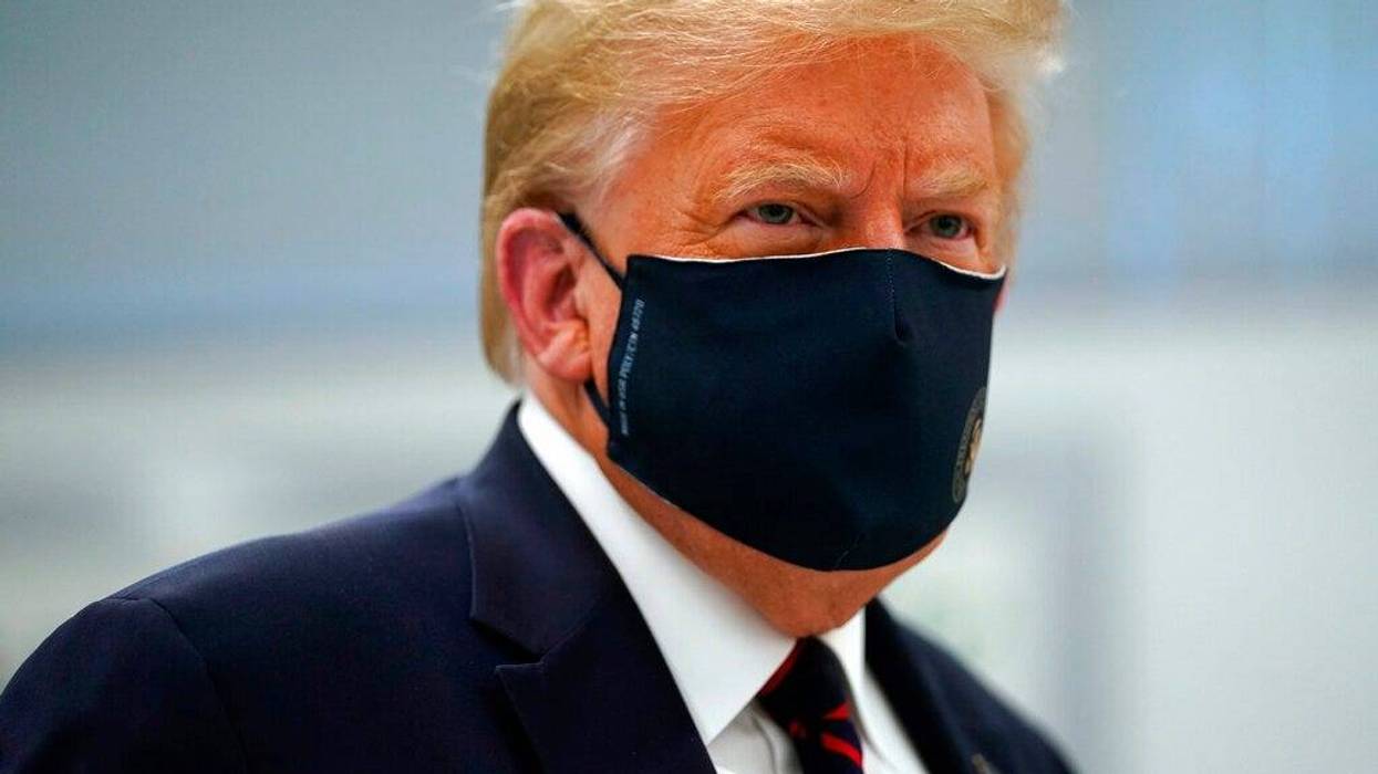 Donald Trump appears in a mask
