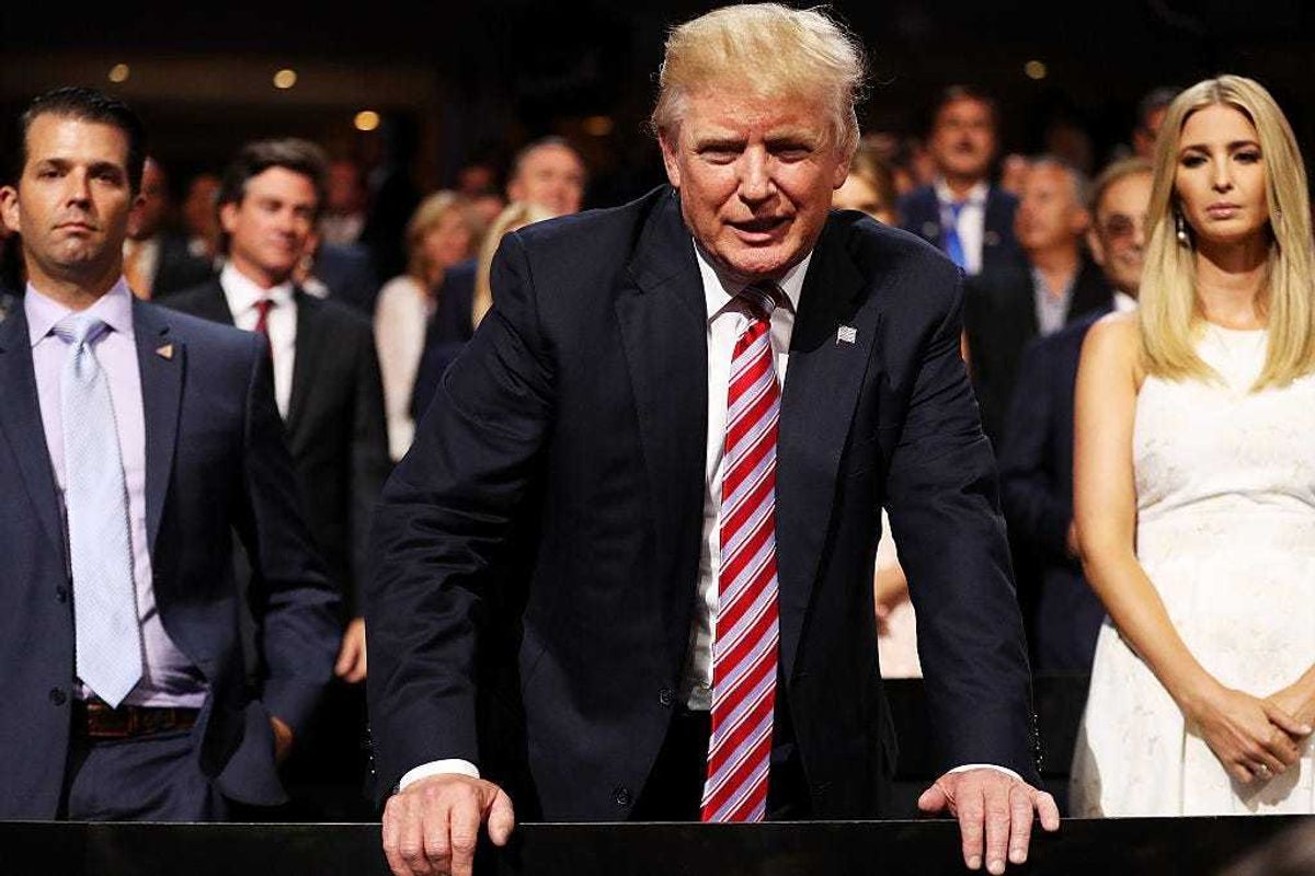 Donald Trump (C) speaks to delegates as Donald Trump Jr. (L) and Ivanka Trump (R) look on during the third day of the Republican National Convention on July 20, 2016 at the Quicken Loans Arena in Cleveland, Ohio.
